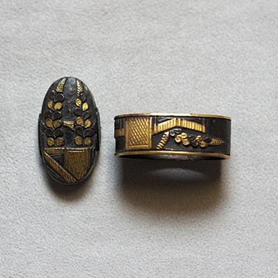 Fuchi Kashira, Pflanzen hinter einem Zaun